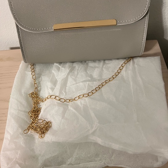 Non Brand Gray Crossbody, never used, smoke free home. Comes with a dust bag. - Picture 4 of 6